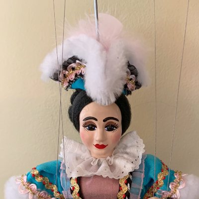Mrs Tryon marionette with feathered hat and fancy gown