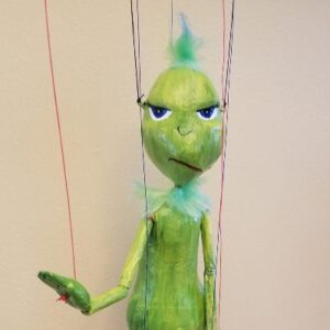 closeup of green "grunch" marionette