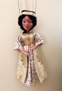 Tudor Lady marionette wearing white brocade dress with gold pinafore