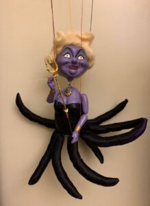 Ursula monster with yellow hair, purple body and black octopus body