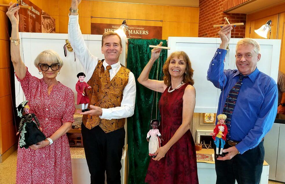 Two females and two males dressed up for formal event